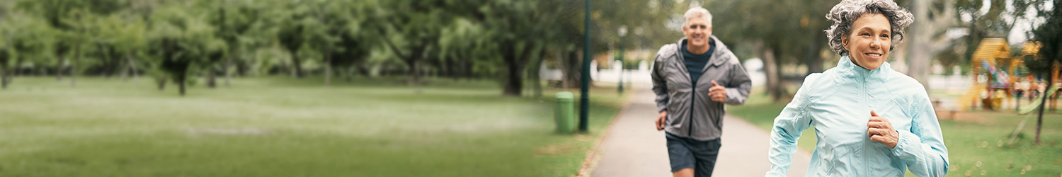 Senior Couple Running Outside