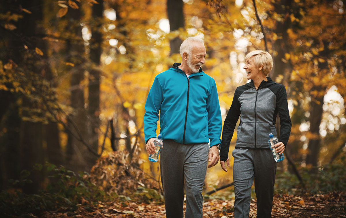 Senior couple taking a walk in the fall