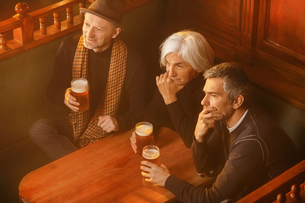 Seniors at a pub watching a game