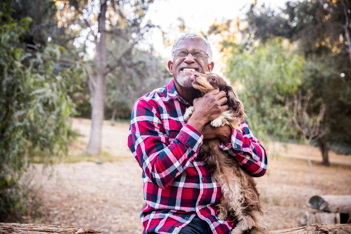 Senior man holding his dog