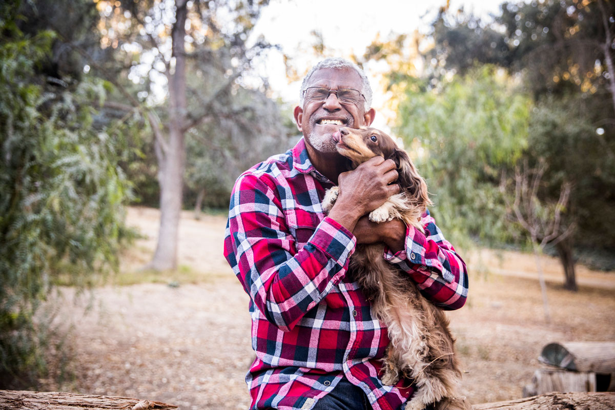 Senior man holding his dog