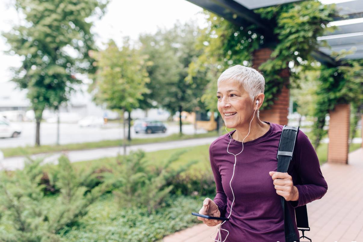 Senior woman listening to favorite podcast